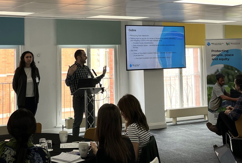 Dr Nason Maani and Dr Kristina Kim present initial research findings at the Local Health Global Profits annual meeting.